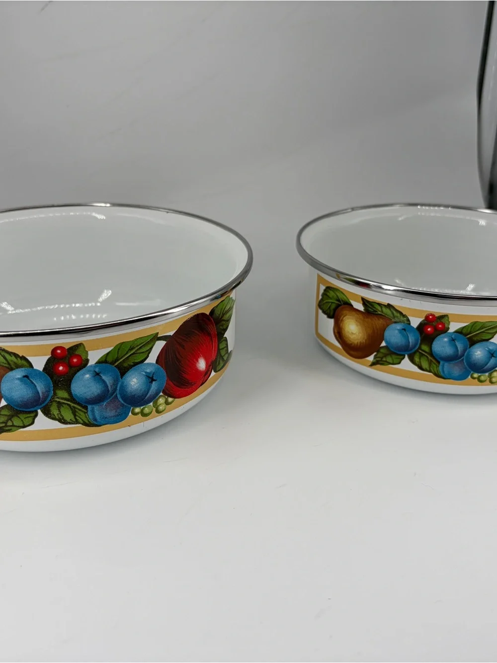 Tabletops Unlimited set of 2 EDEN enamel metal bowls.